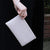 ivory lattice leather clutch bag  held for 14th wedding anniversary gift as worn